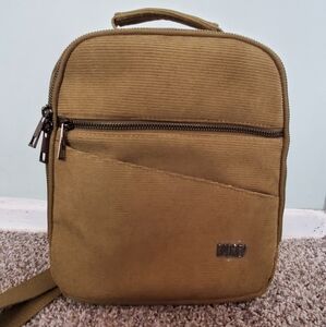 Olive green Rad Rev mini backpack.